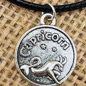 Capricorn Zodiac Necklace – Silvertone Astrology Pendant on Black Leather Cord